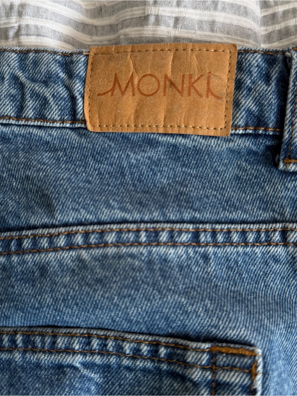 Monki Light Blue Denim Flare Jeans with Tan Patch